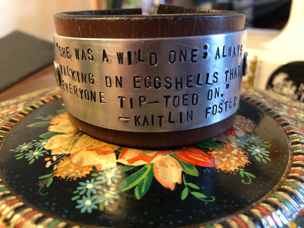 Upcycled and reclaimed “Quoteables” leather cuffs