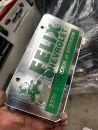 Image 1 of CHROME & GREEN FELIX CHEVROLET ICONIC LICENSE PLATE 