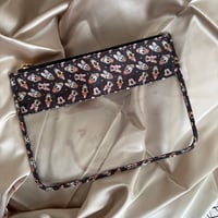 Image 2 of neutral magical friends vinyl pouch