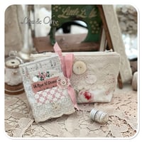 Image 1 of sewing zipper purse and needle book and tiny glass bottle of vintage buttons