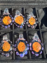 Gold fume flower pendant
