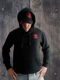 Image 1 of Black Nom4d Hoodie and Black or White Cap Combo