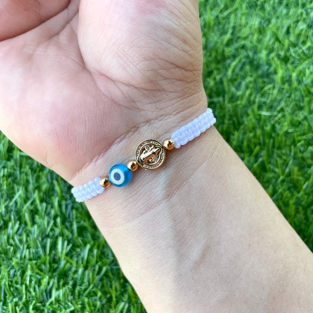 San Benito with blue evil eye bracelet