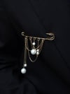 Brooch with chains and pearls 
