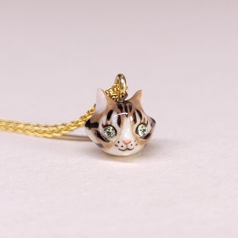 Image of Brown Tabby Porcelain & Gold Vermeil Teeny Tiny Cat Pendant