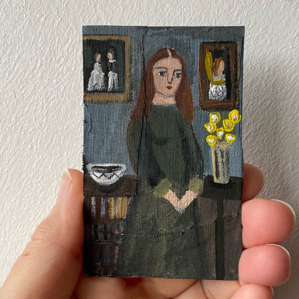 Image of Woman in interior with bookcase - tiny portrait 