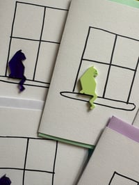 Image 8 of Cat Sitting In A Window