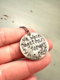 Image 5 of green sapphire pendant with handwritten quote