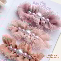 Image 1 of Ruffle Clips 