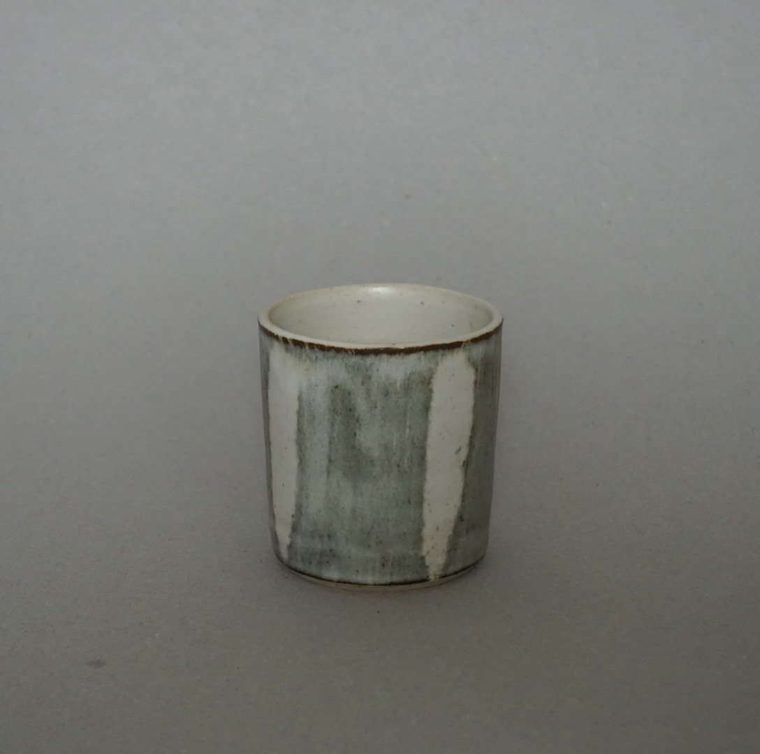 Image of Brown and White Cup