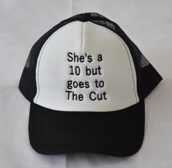 Image of “SHES A 10 BUT…” Trucker Hat