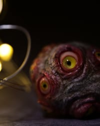 Image 7 of Egg of the King pendant, leather cord, brass hardware, all seeing glowing eyes