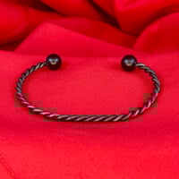 Two Twisted Black Spoke Cuff