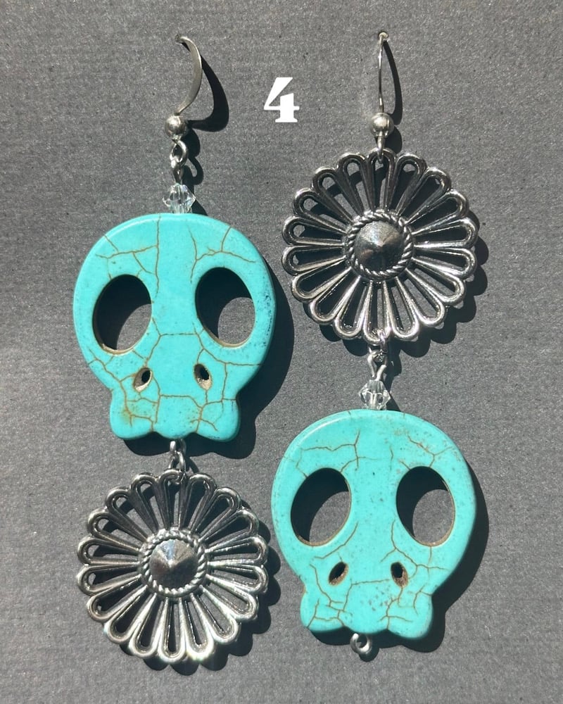 Image of blue skull earrings