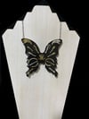 Skull and bone butterfly pendant 