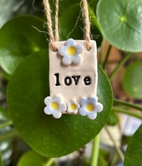 Image 1 of Ceramic 'love' or 'be kind' little flower Tile 
