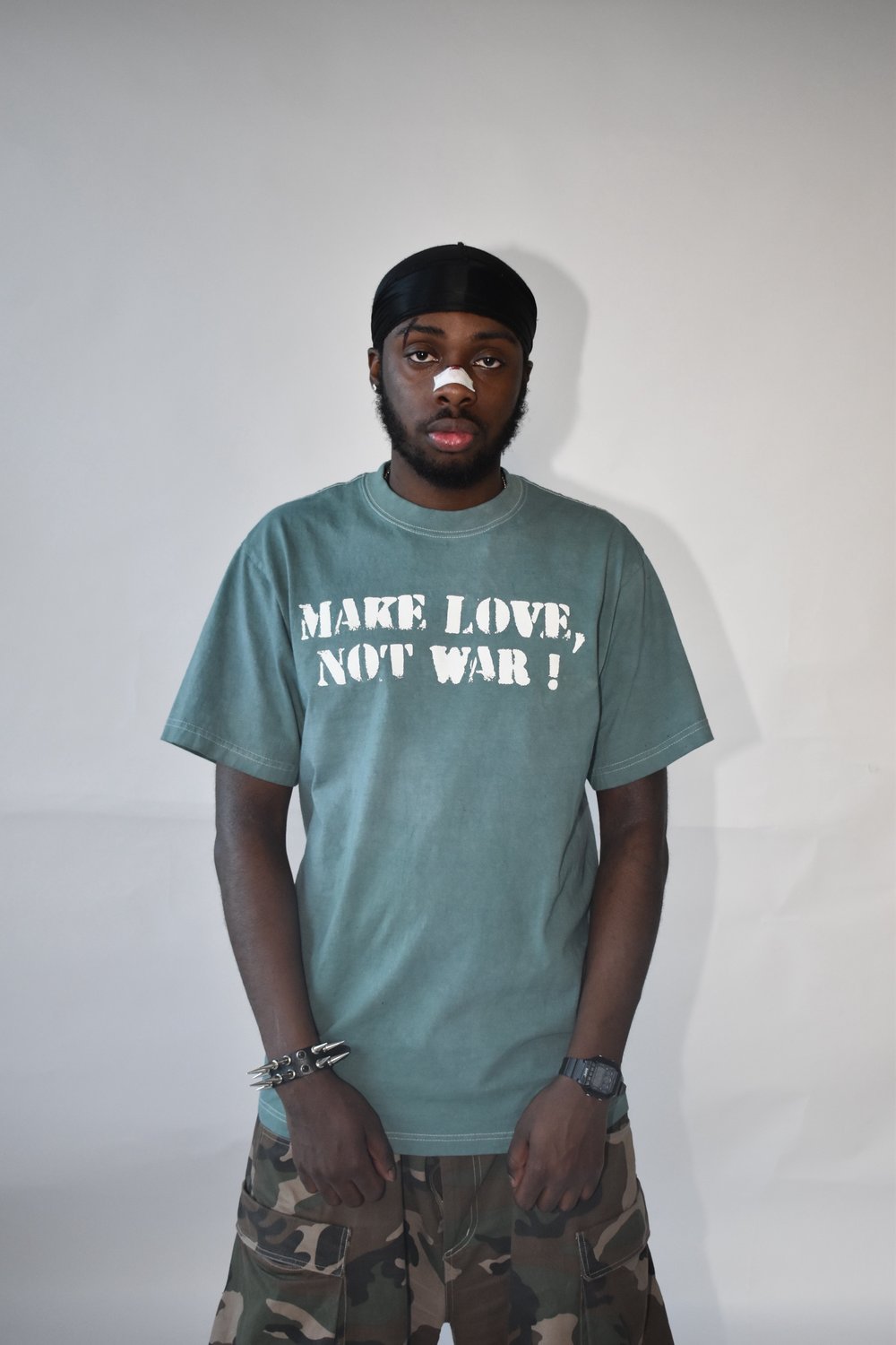 GREEN MAKE LOVE N☮︎T WAR TEE