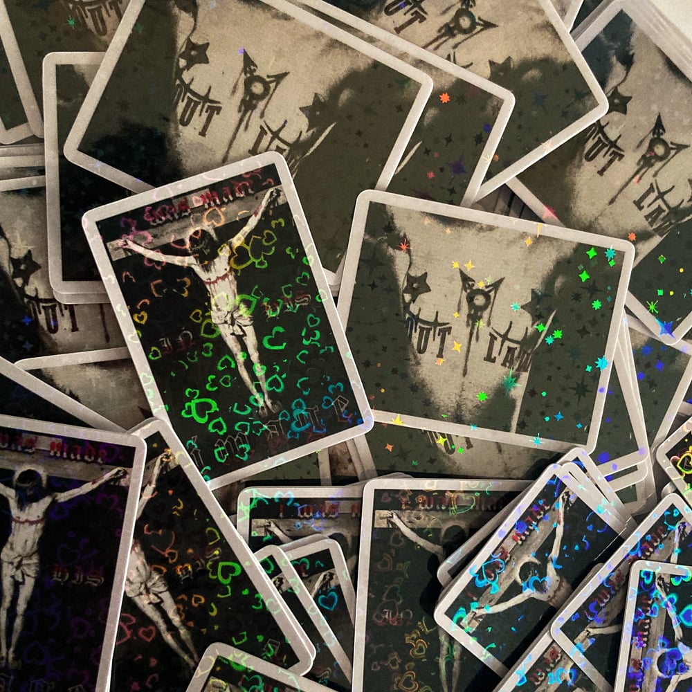 Image of “MADE IN HIS IMAGE” and “OUTLAW” 1.5” holographic stickers