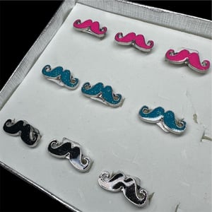 Image of glittery mustache rings