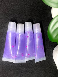 Image 1 of 4 clear purple lavender lip gloss