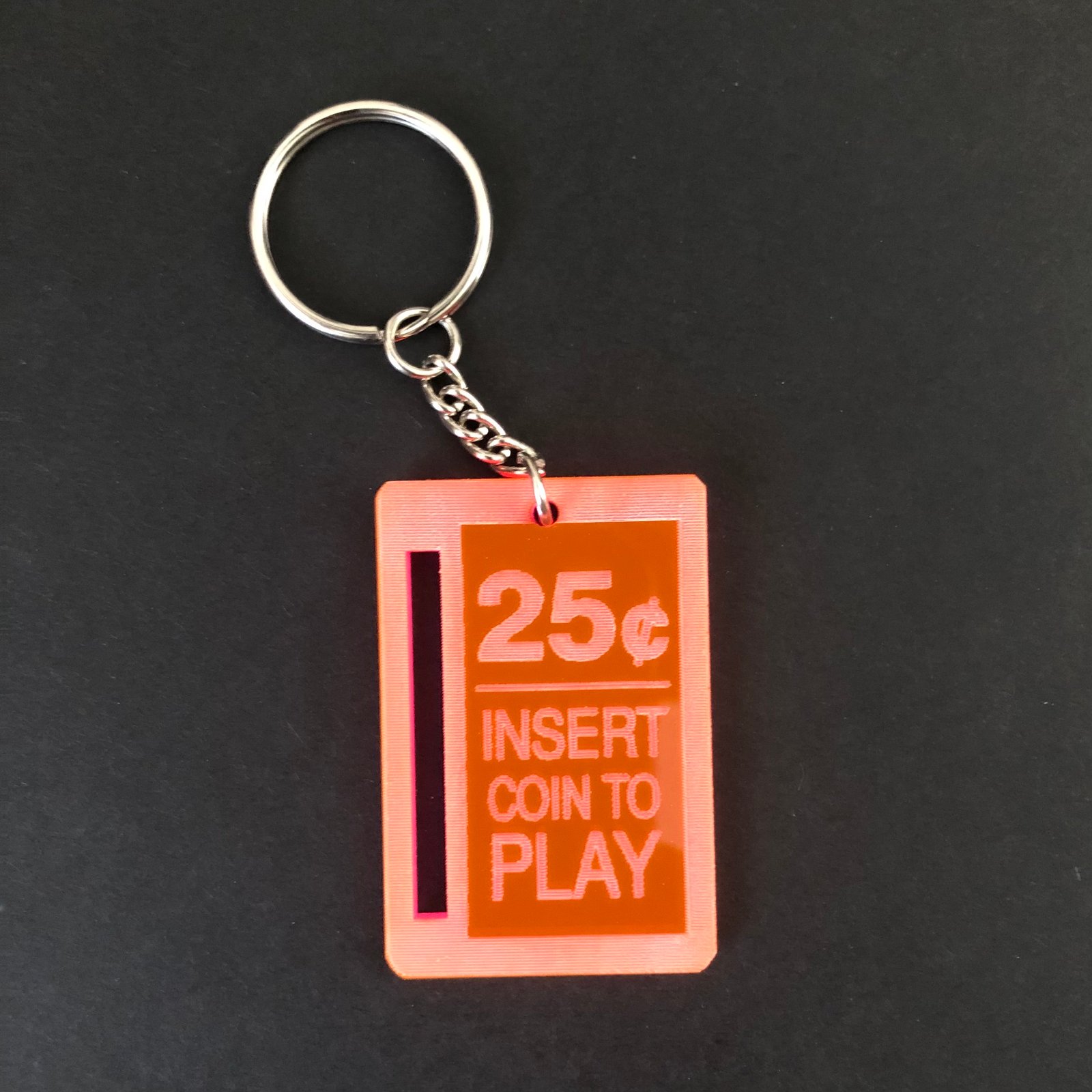 Insert coin to hot sale play keychain