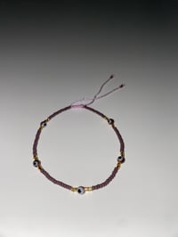 Image 1 of Purple evil eye purple bracelet 