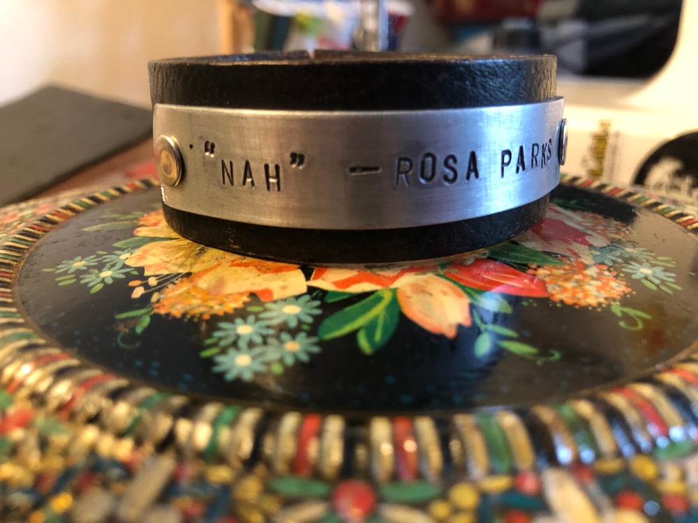 Upcycled and reclaimed “Quoteables” leather cuffs