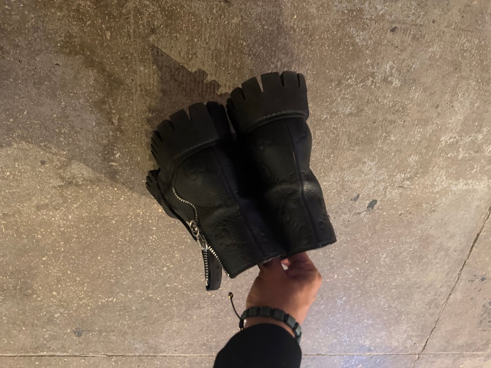 Image of Gucci Monogram Debossed Lug Boots
