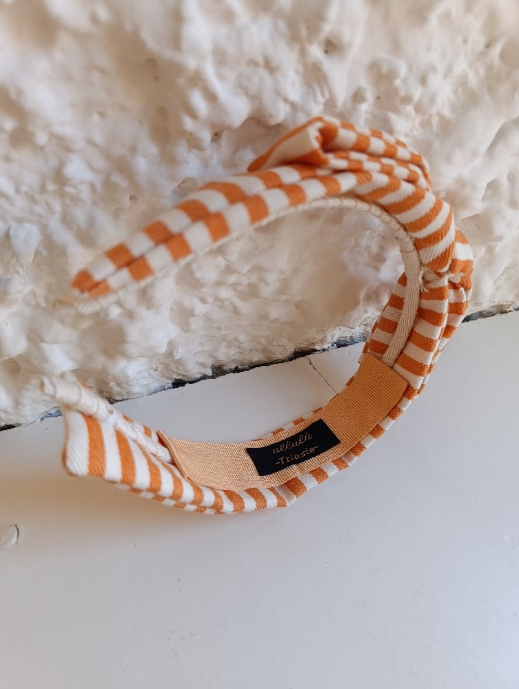 Image of Cerchietto a fiocco righe bianco/arancione