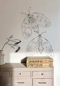 Image 2 of wire moth sculptures
