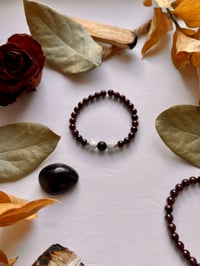 Image 1 of Garnet with Howlite/Onyx
