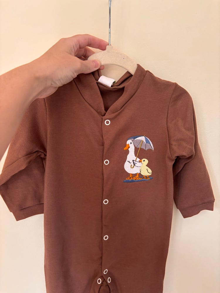Image of Brown baby grow 12-18