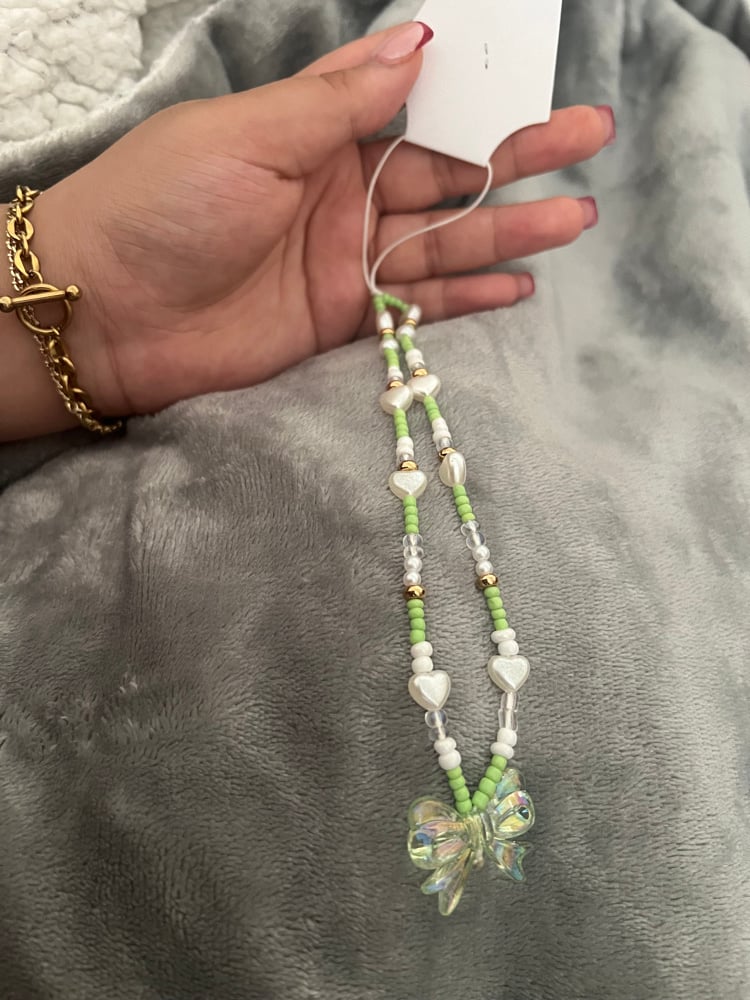 Image of green bow phone charm 