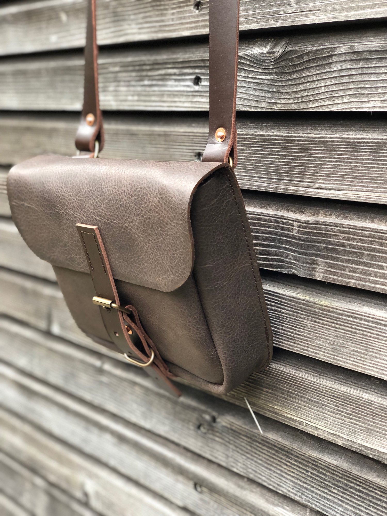 Image of Daybag in dark brown oiled leather with shoulder strap unisex collection