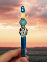 Image 1 of Cowboy Hat On Blue Pen