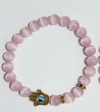 Image 1 of Heart Shield Bracelet: Pink Cat Eye Quartz + Hamsa Hand