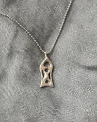 Image 1 of X charm