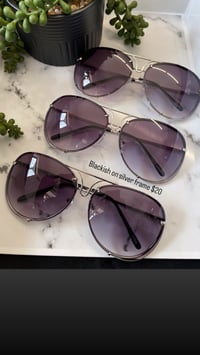 Blackish on silver frame shades