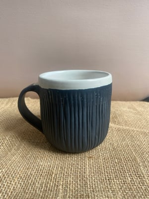 Image of carved mug black