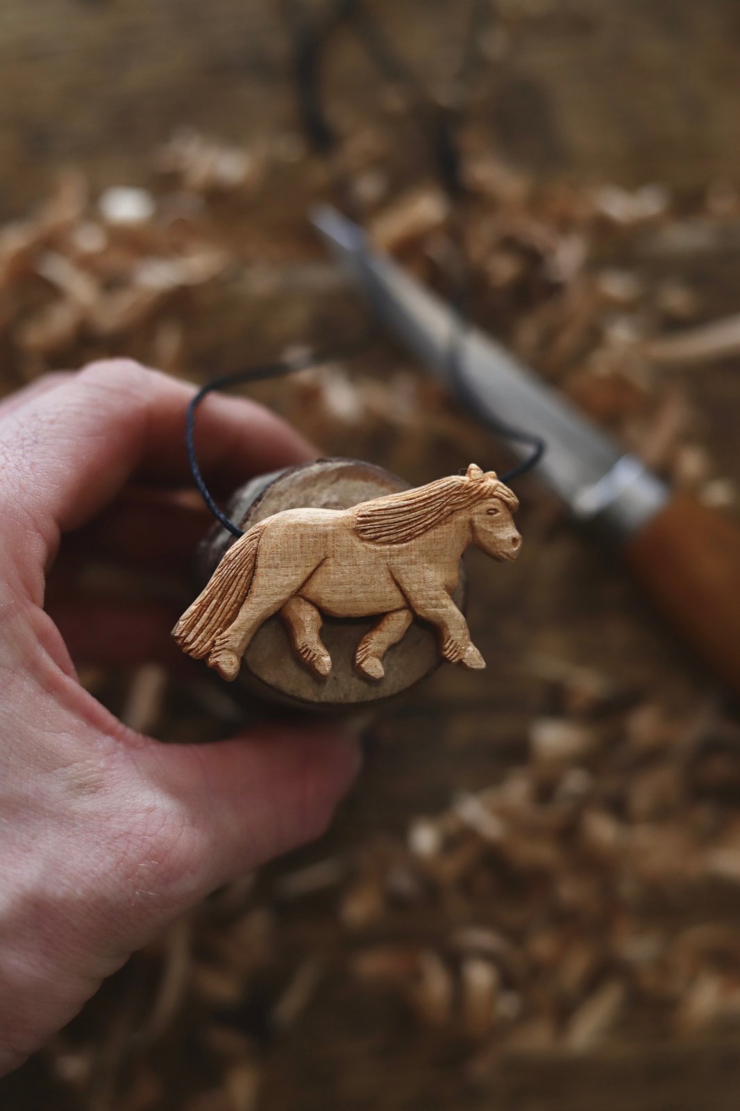 Wood on sale carved pendant