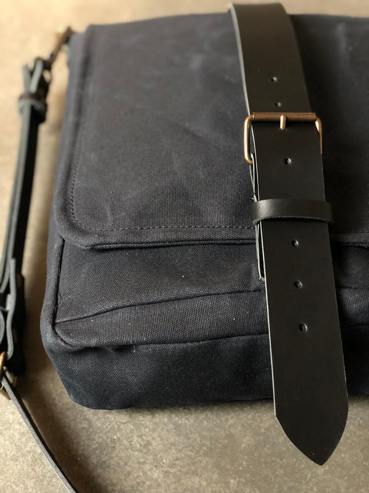 Image of Mens messenger bag in waxed canvas with leather adjustable shoulder strap and closing flap