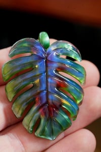 Image 3 of Blueberry green mixed color monstera leaf pendant. 