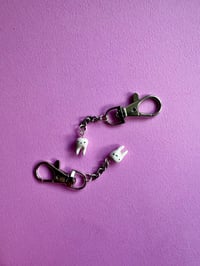 Image 3 of micro tooth charm