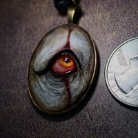 Image 2 of Pennywise Eye glow in the dark pendant OOAK