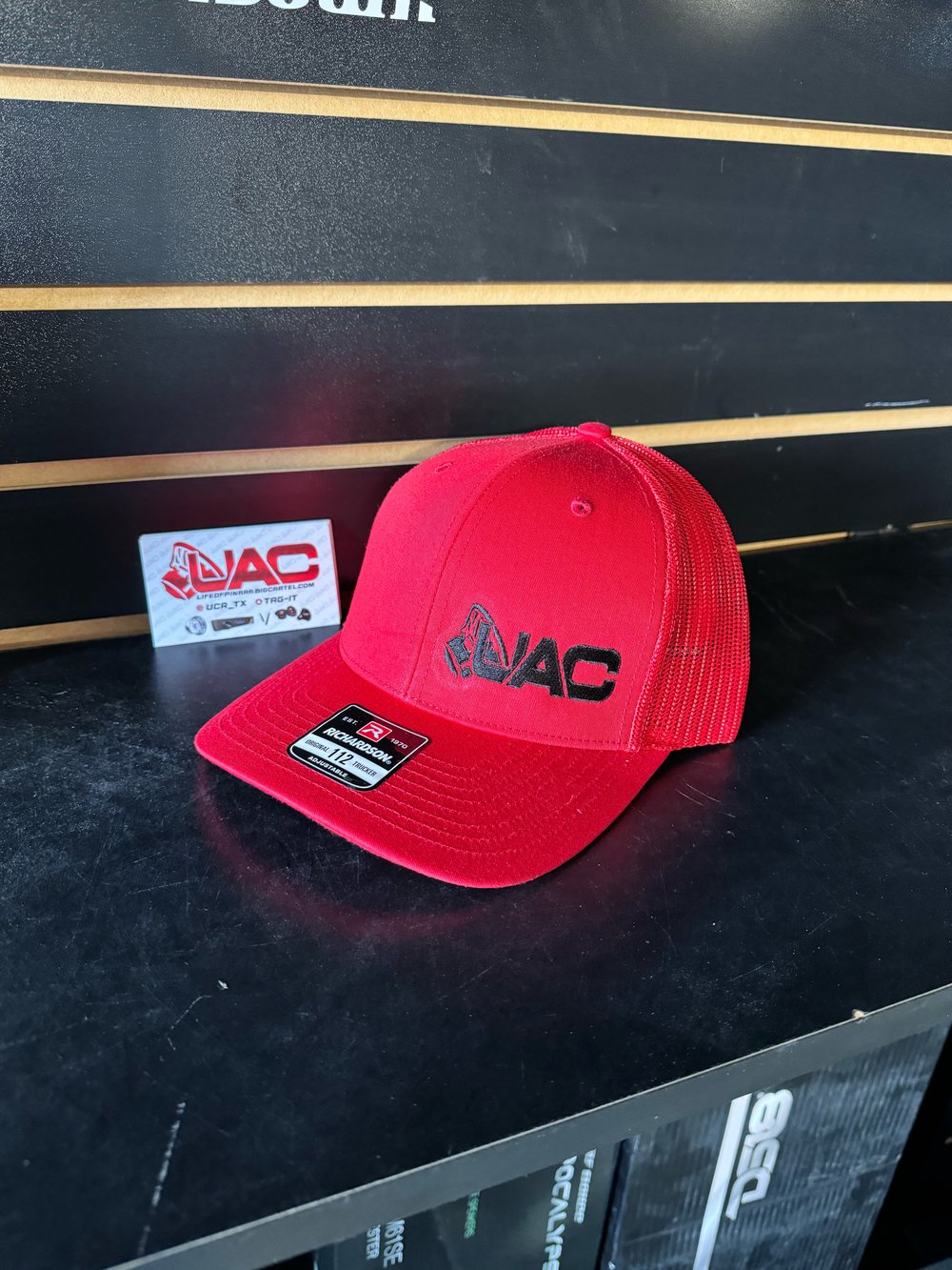 UAC hat black and red 