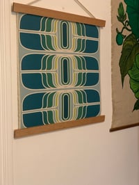 Image 1 of ‘Teleport’ in teal small Vintage Groove wall hanging 