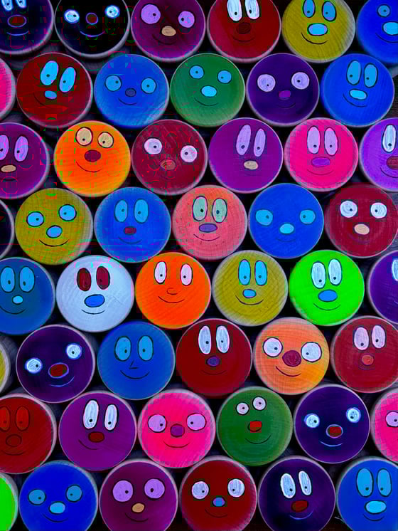 Image of FACES painted maple wood Wing Yo-Yos