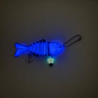 Image 1 of blue/purple glow in the dark skeleton fish keychain