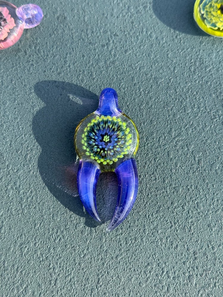 Image of  Green and purple horned pendant