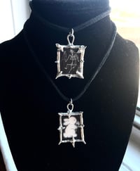 Image of bat skeleton and bunny pendants